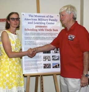 Circe and Allen "Ole" Olsen with an exhibit they created for the Museum